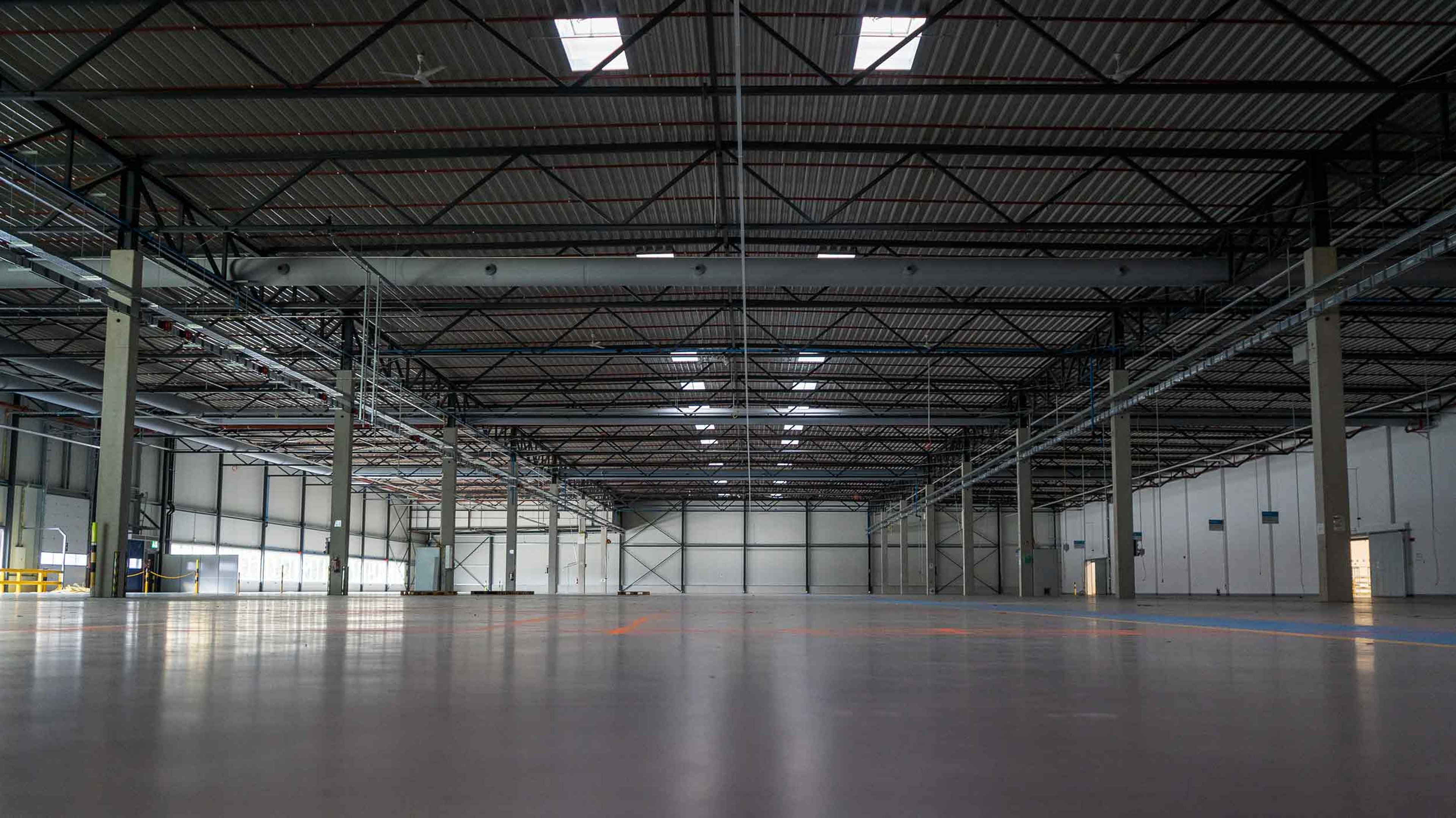 Empty manufacturing hall. in what was once an automotive startup in Aachen, Germany, Exyte is building and engineering a semiconductor fab pilot manufacturing line for Black Semiconductor