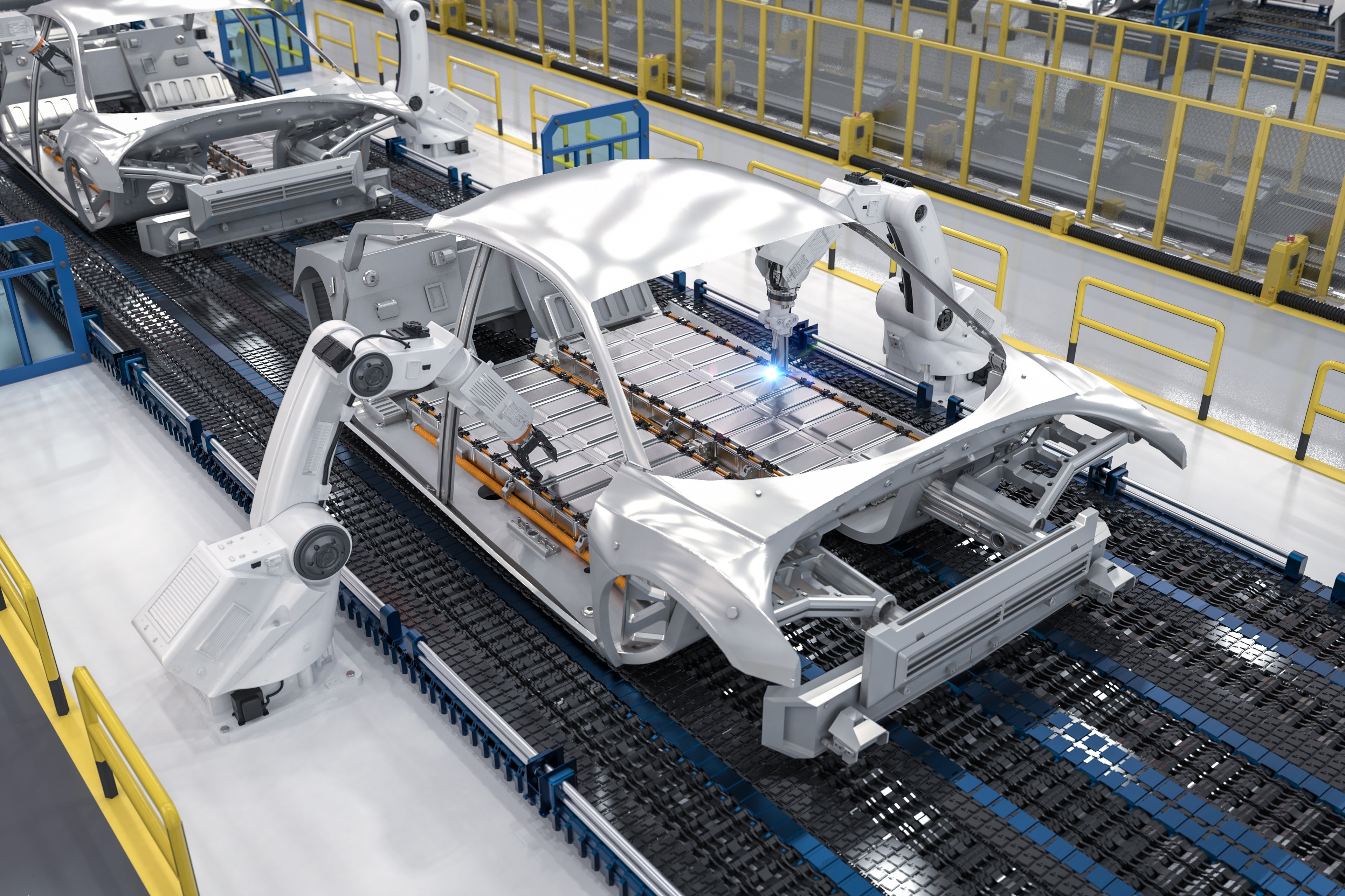 Robotic arms assembling electric car frames on a high-tech production line, performing tasks like welding in an automated industrial setting with safety barriers and yellow railings.