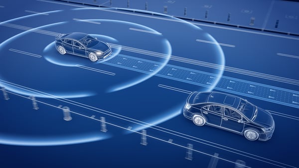 Rendered image of a car driving on a road while simultaneosly emitting signal waves to symbolize autonomous driving trends