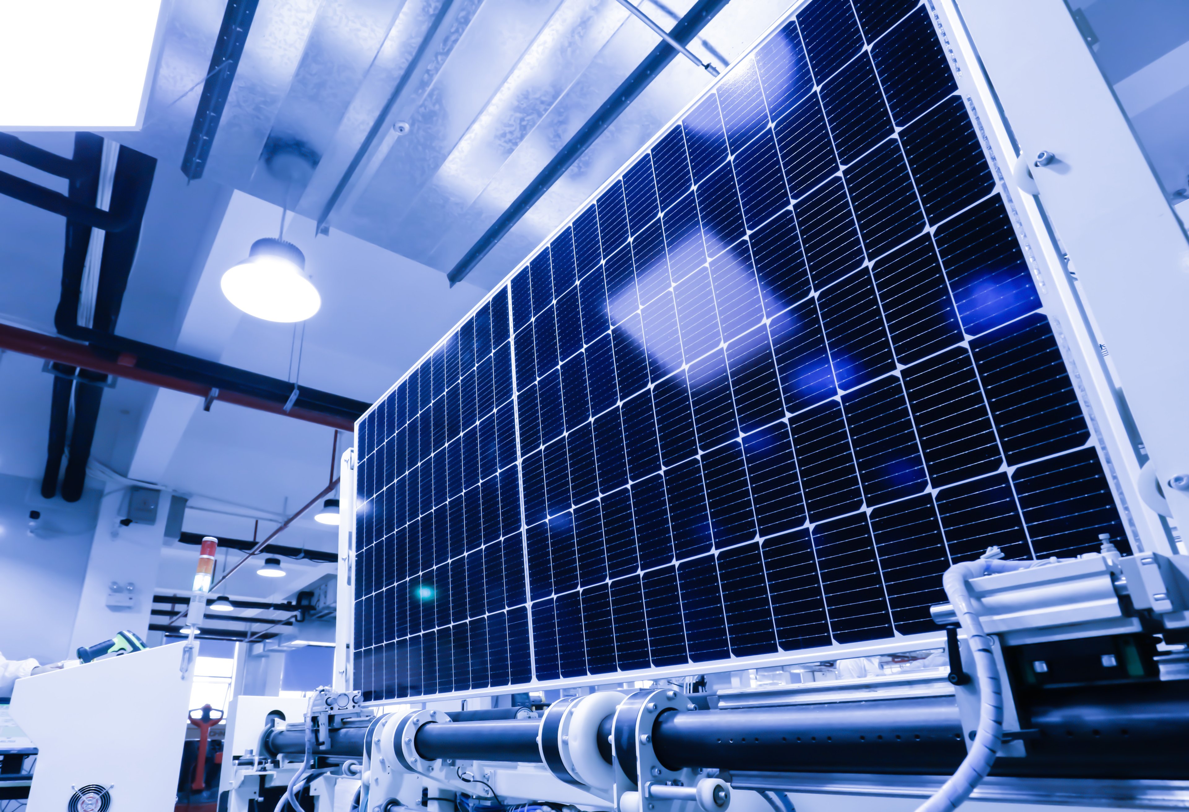 A close-up of a photovoltaic panel in a production facility, highlighting advancements in solar energy technology and sustainable power solutions.