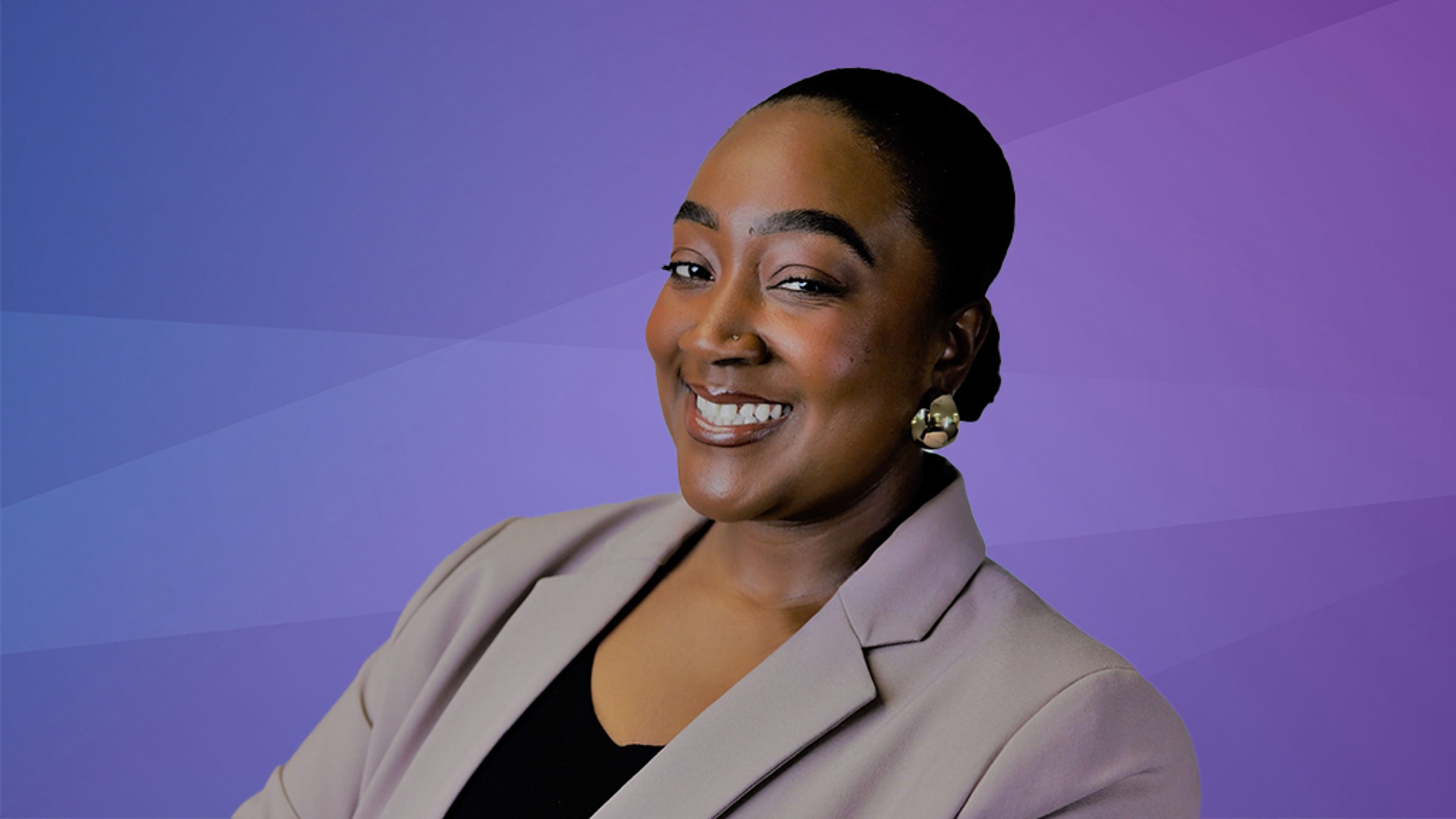 A professional headshot of Myesha Daniels, smiling, wearing a beige blazer and gold earrings against a purple gradient background.