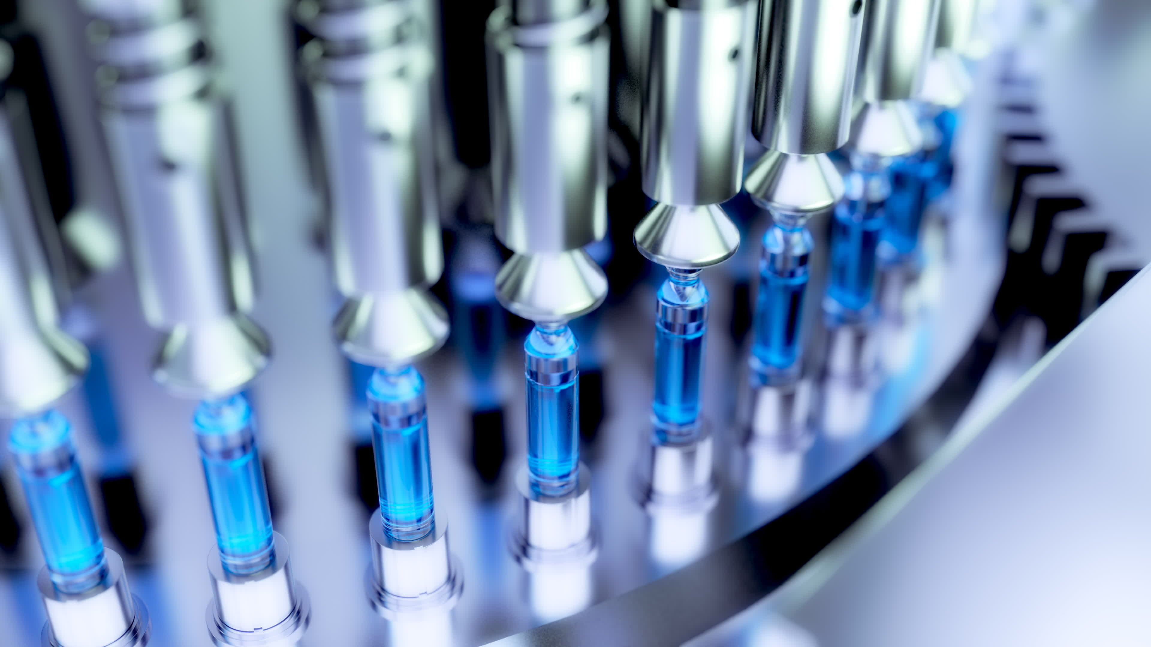 Ampoules being filled with a pharmaceutical liquid in a factory