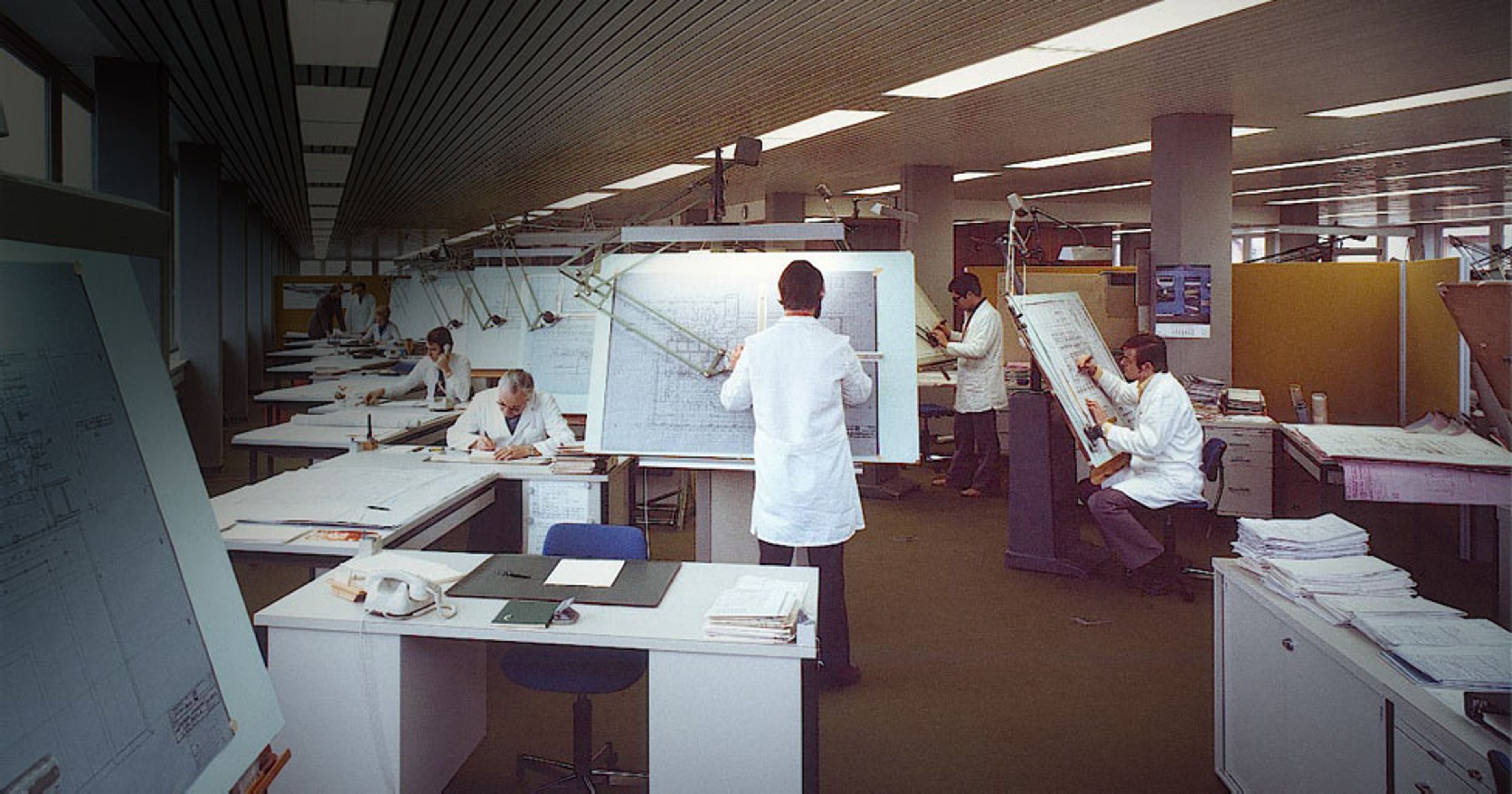 Image of Exyte employees working on facility design plans in the 1960s