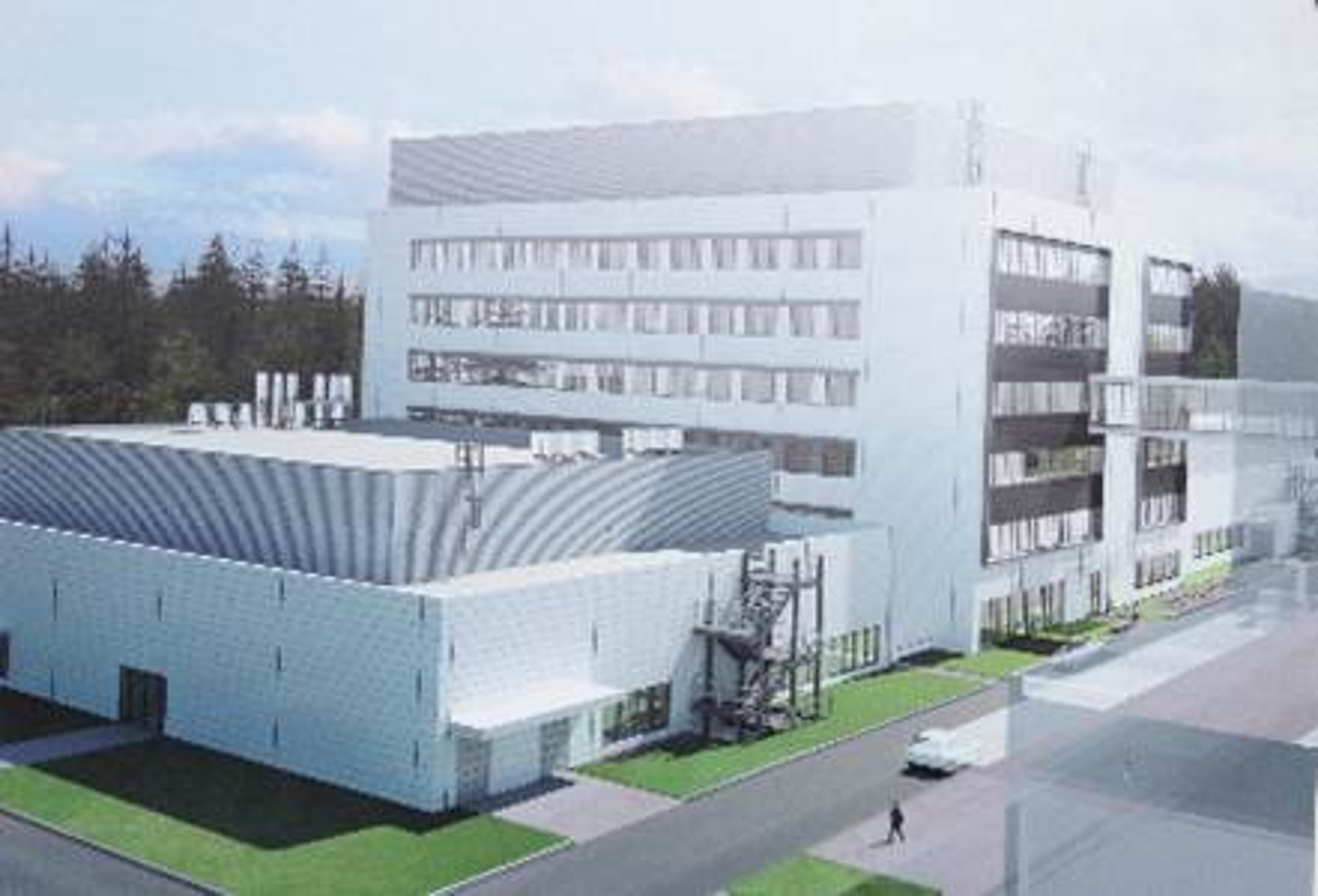 An exterior view of a production building and laboratory in Penzberg, featuring a multi-story modern structure with adjacent facilities and green surroundings.