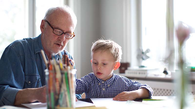 Grandpa draws a picture with grandson