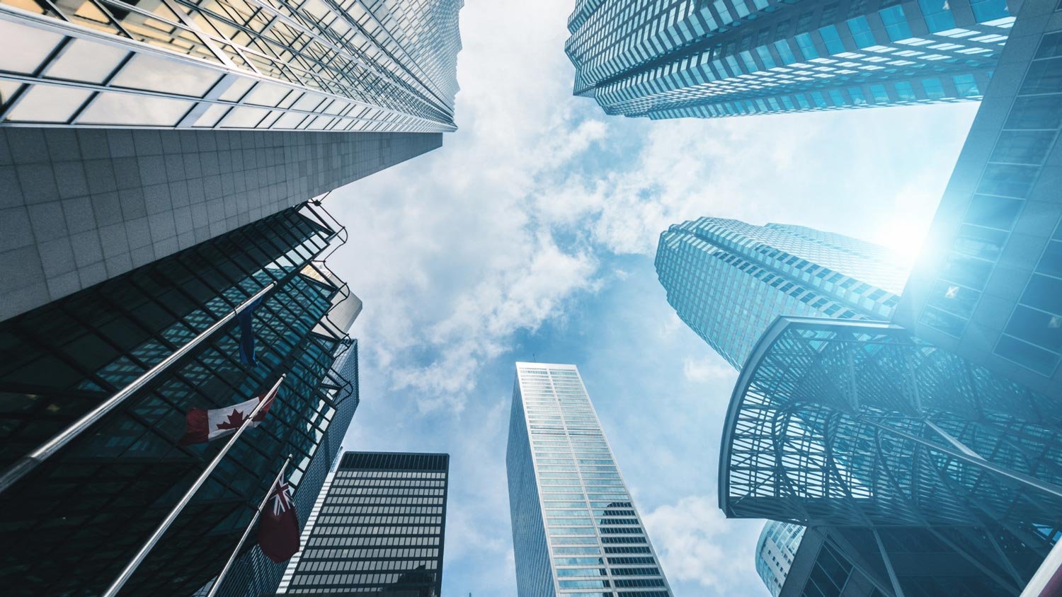 Skyline of Toronto with modern skyscrapers and blue sky.