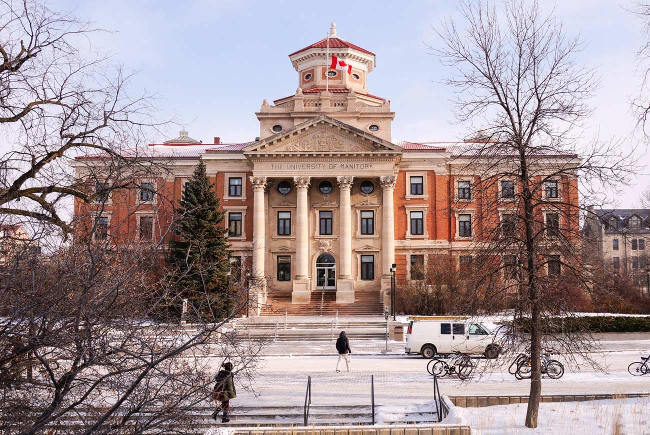 Historical building of the University of Manitoba during winter.