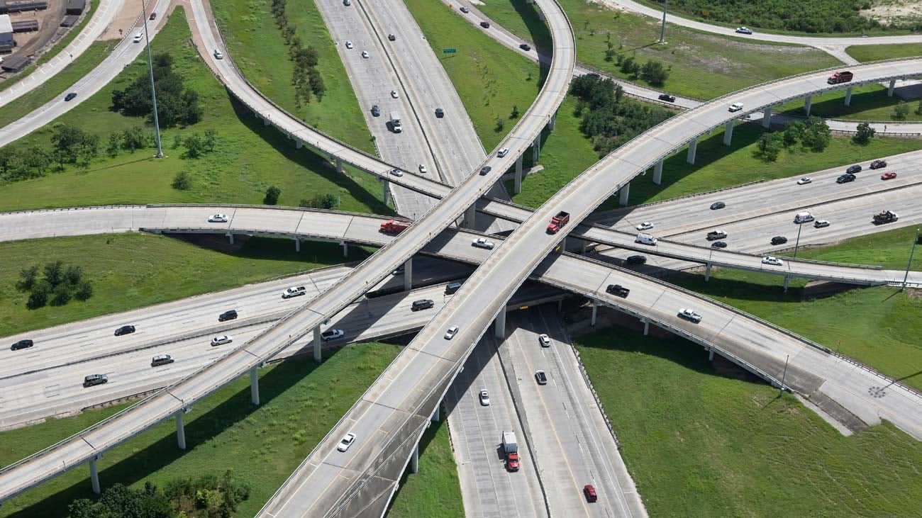 A complex highway interchange with multiple levels and lanes of traffic.