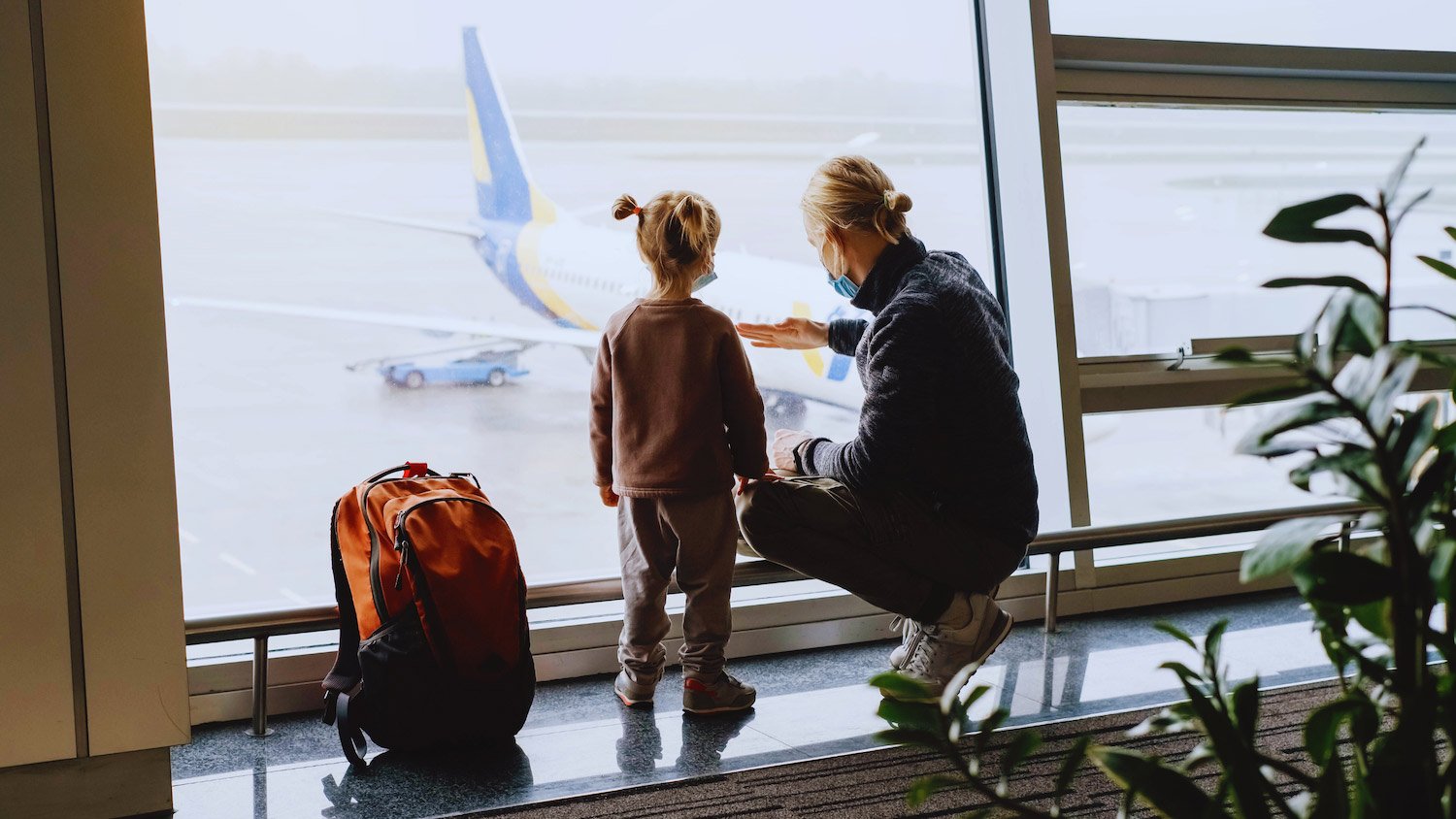 Mom and daughter travelling at the airport