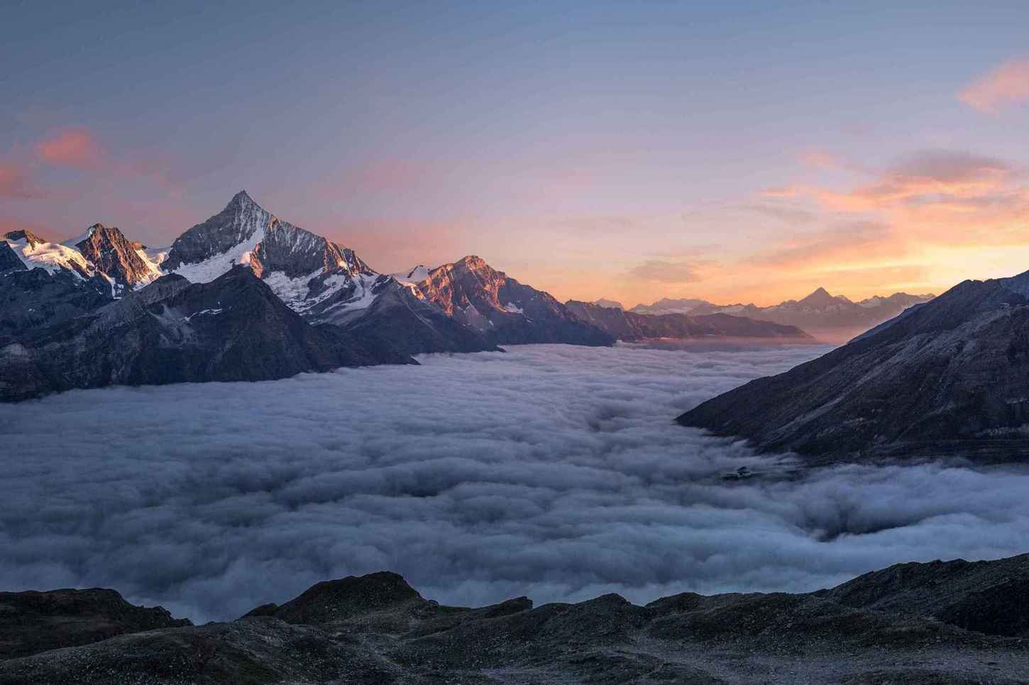 Photo above the cloud line on top of a mountain.