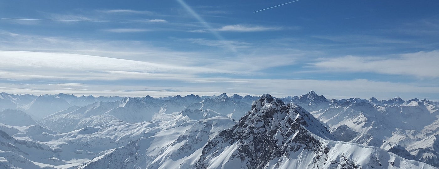 Blue sky and snowy mountain peaks