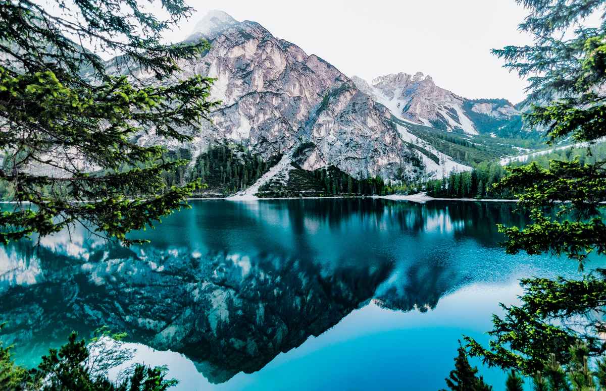 A still blue lake in the mountains.