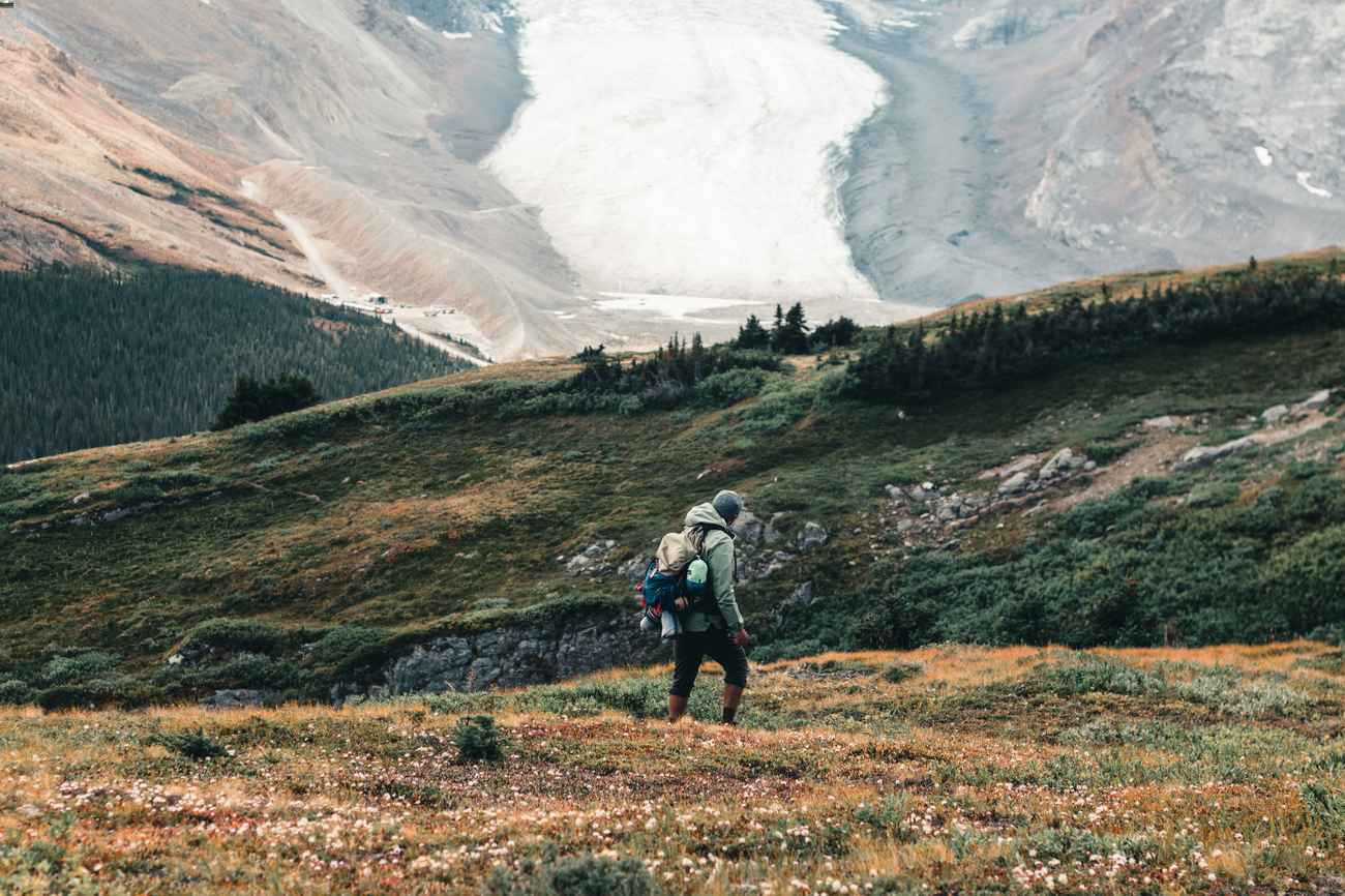 Male hiker overlooking a previous avalanche.