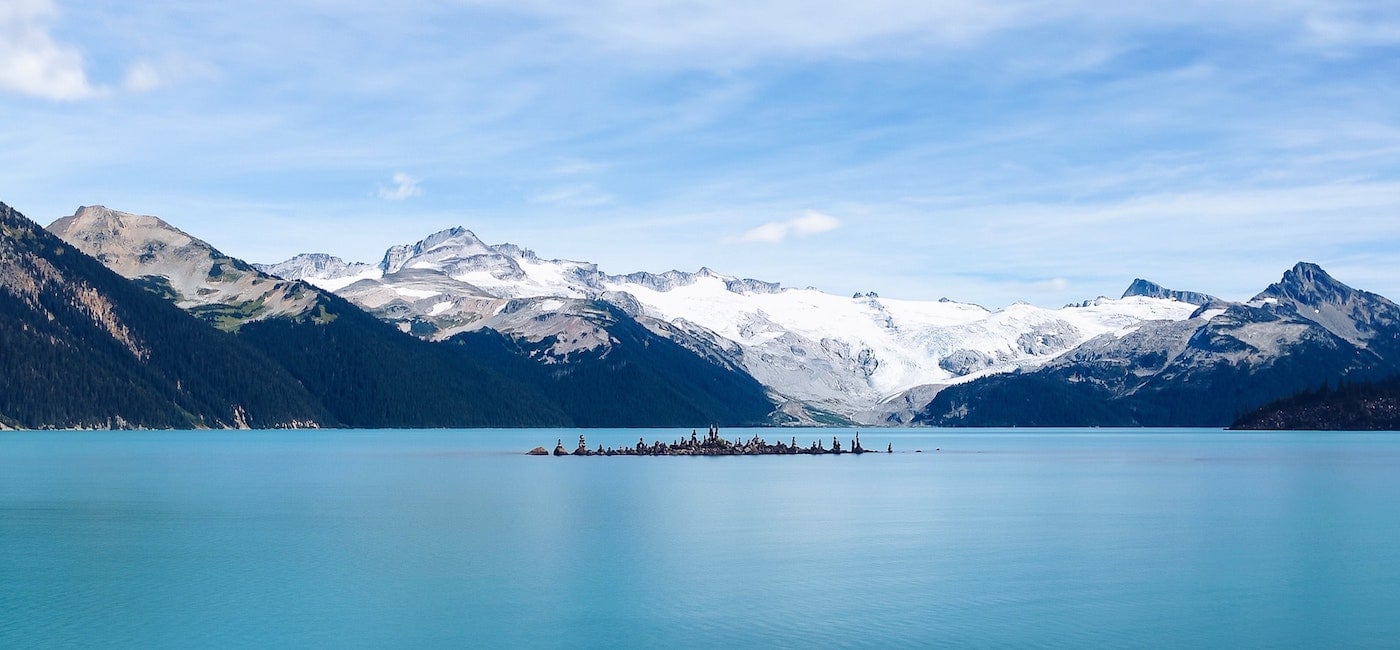 A mountain range across a large blue lake