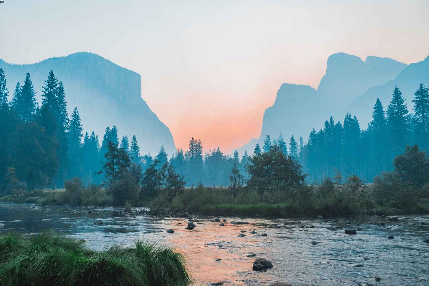 Sunsetting behind a mountain landscape