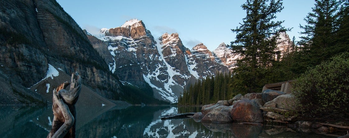 A big tree stump and lake in the mountains