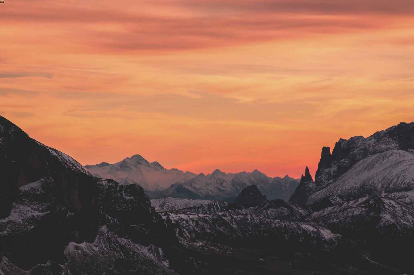 Orange sky behind mountains