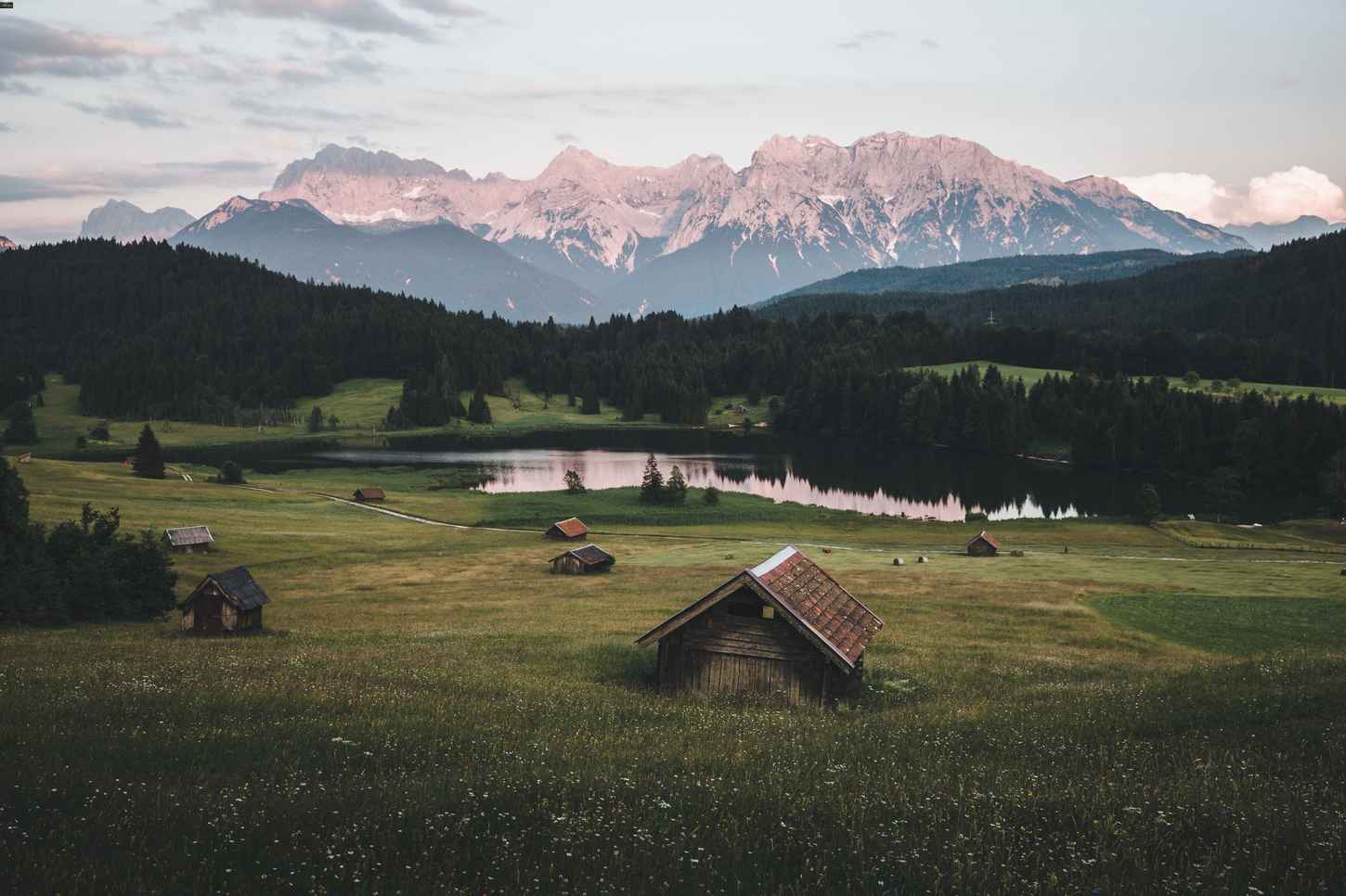 Old houses in front of mountains