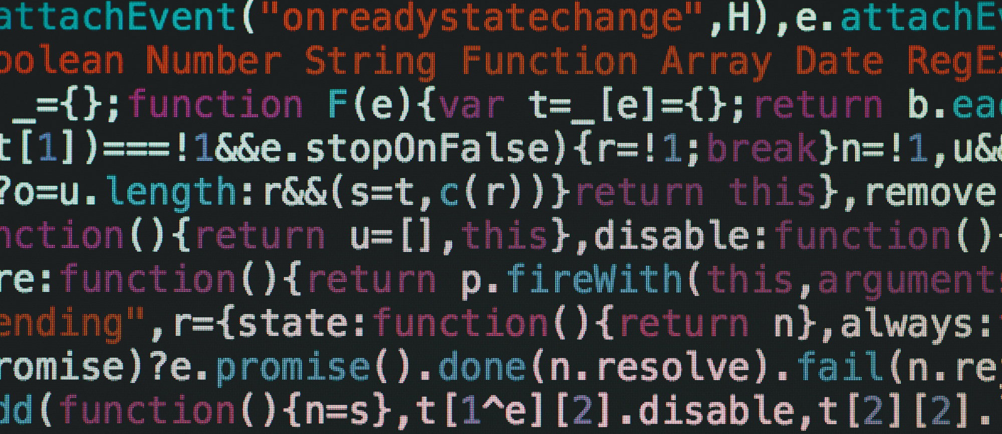 Close-up view of colorful programming code on a monitor, displaying functions and variables.