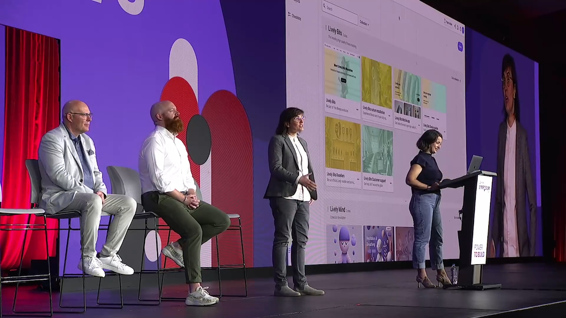 Group of individuals from the product team on stage at Sitecore Symposium 2024. Liz Nelson speaking, Ezgi Gocucu operating a demo, Ru Barry and Steve Davis seated.