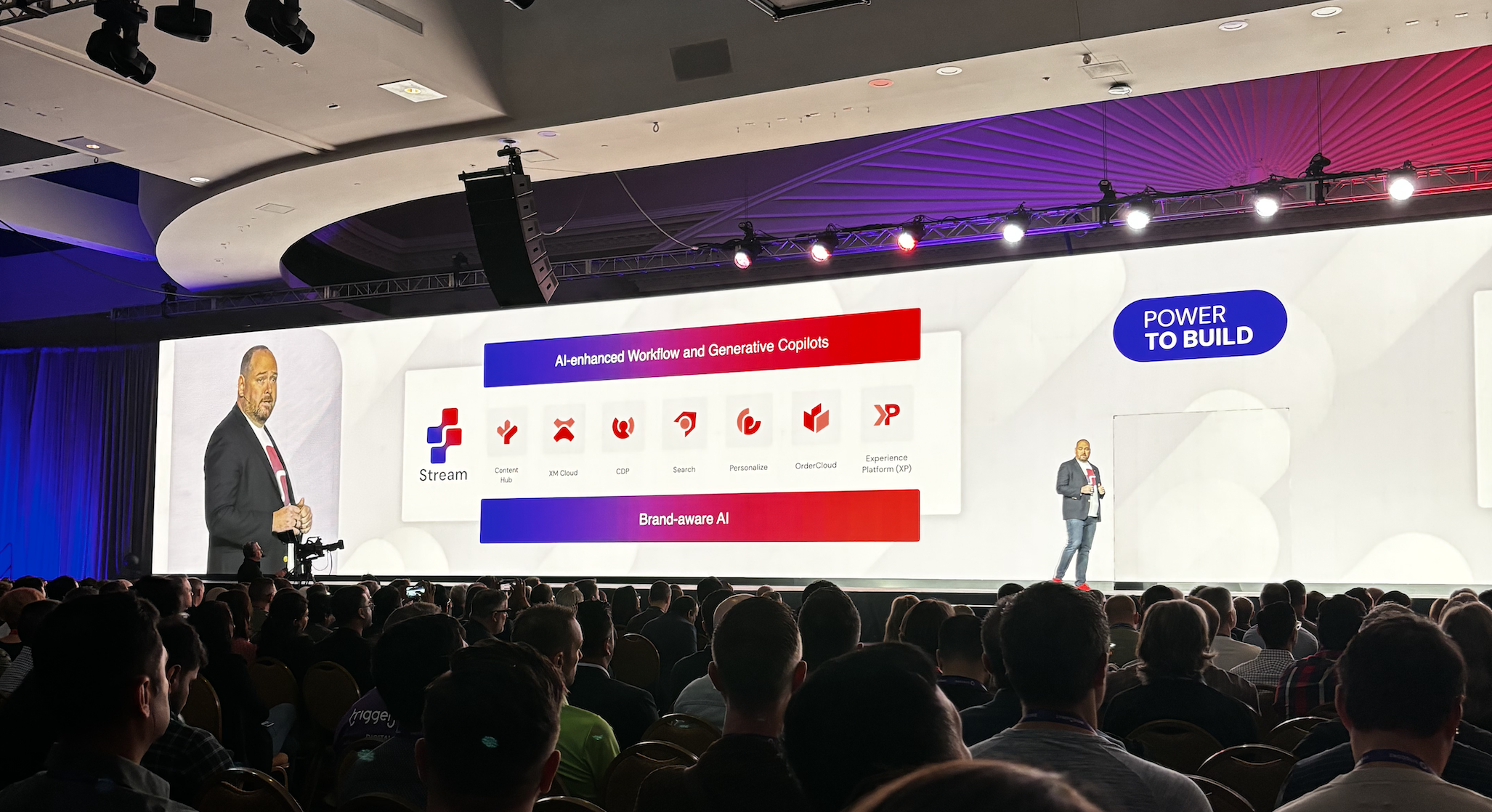 Speaker showing how Sitecore products integrate with AI-enhanced workflows.