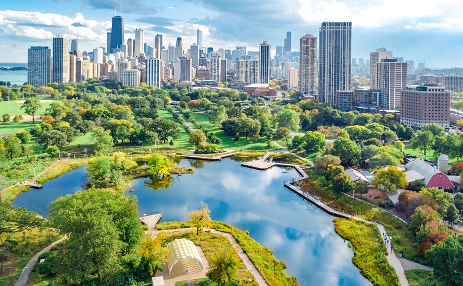 Aerial view of an urban landscape featuring parks and waterfront areas