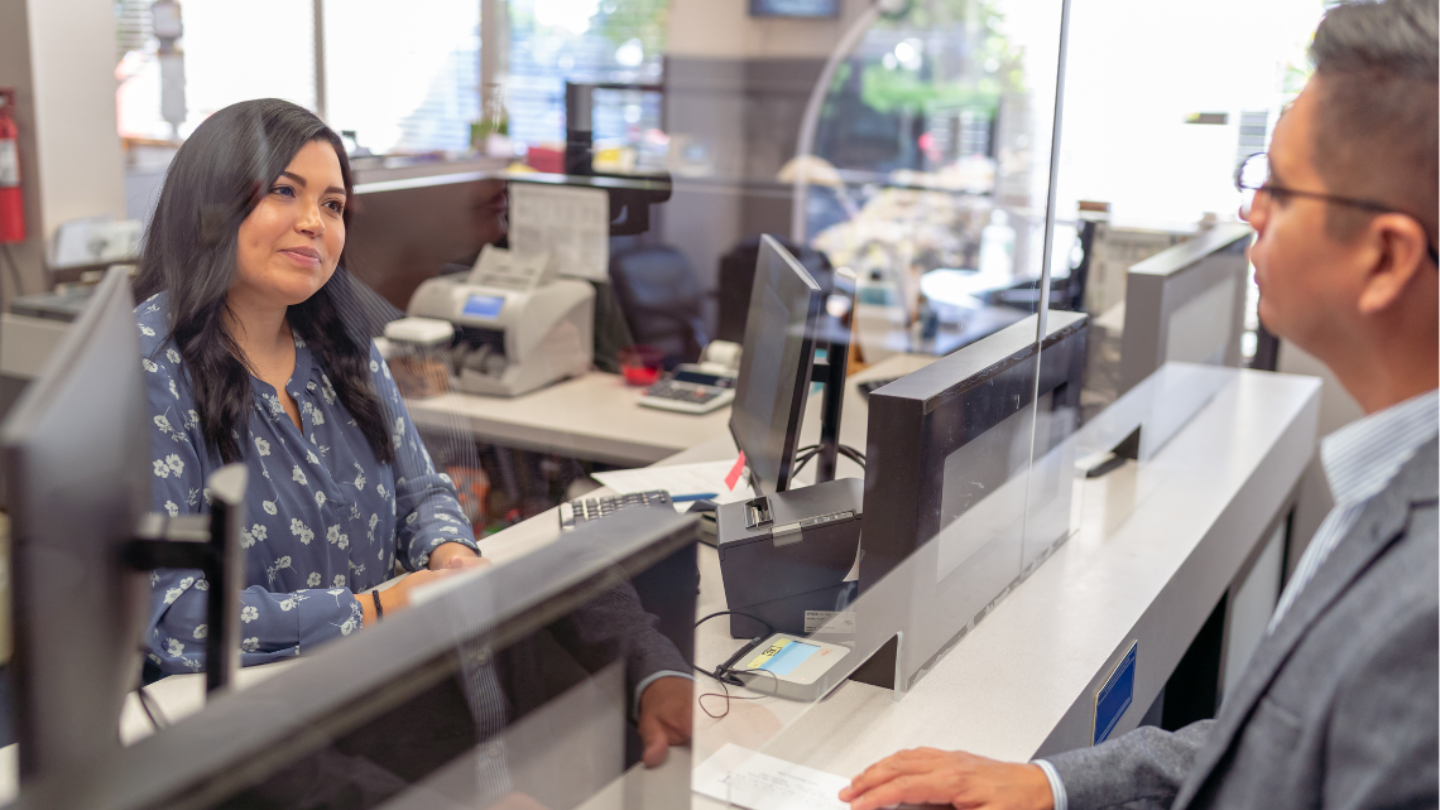 Woman man bank window_1440x810