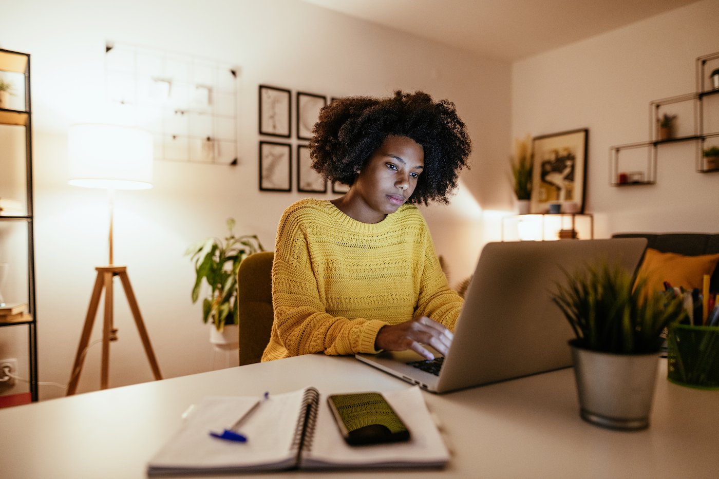 Woman working from home on a laptop after a global pandemic and subsequent economic headwinds