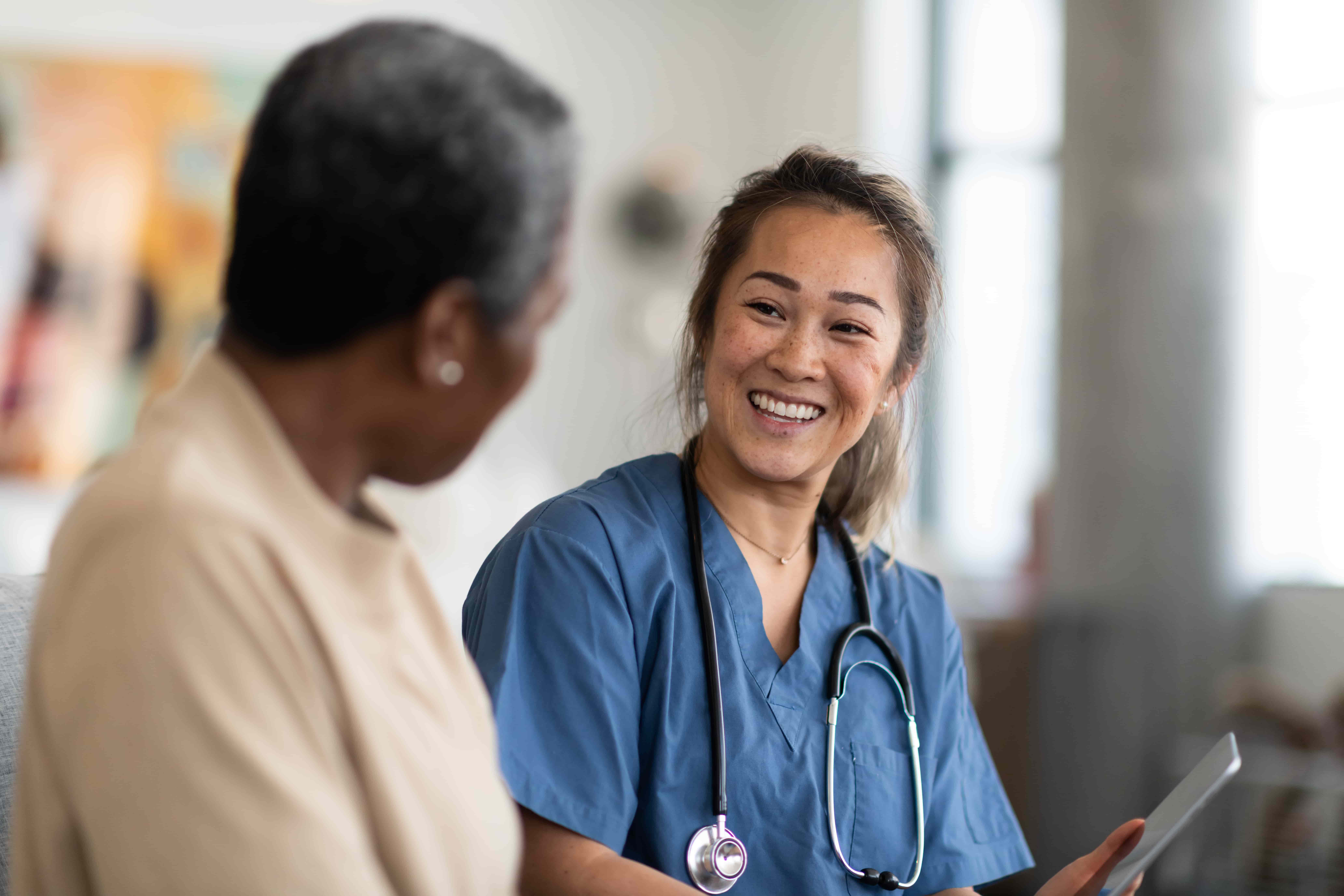 Healthcare professional talking with patient