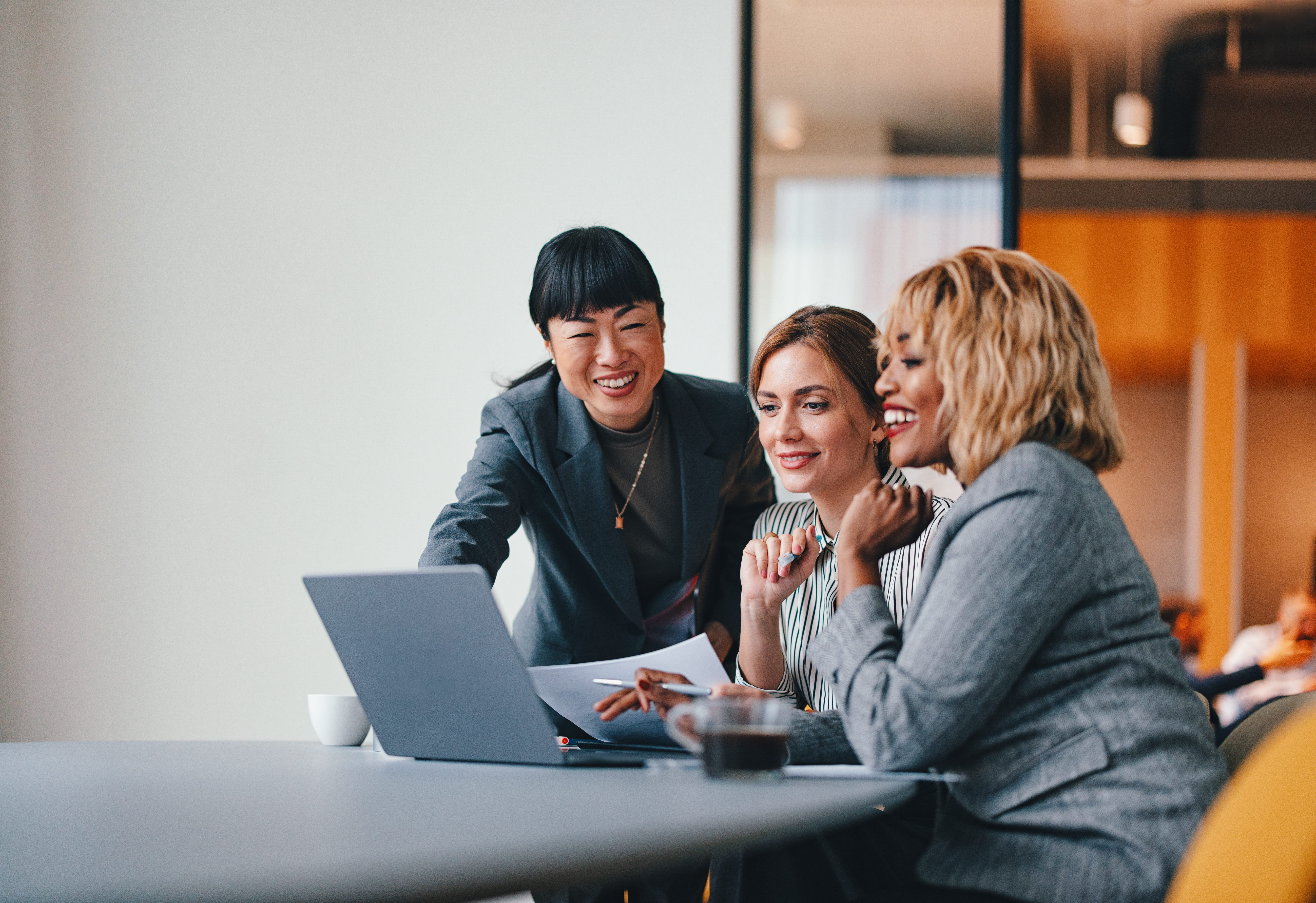 happy-people-around-laptop