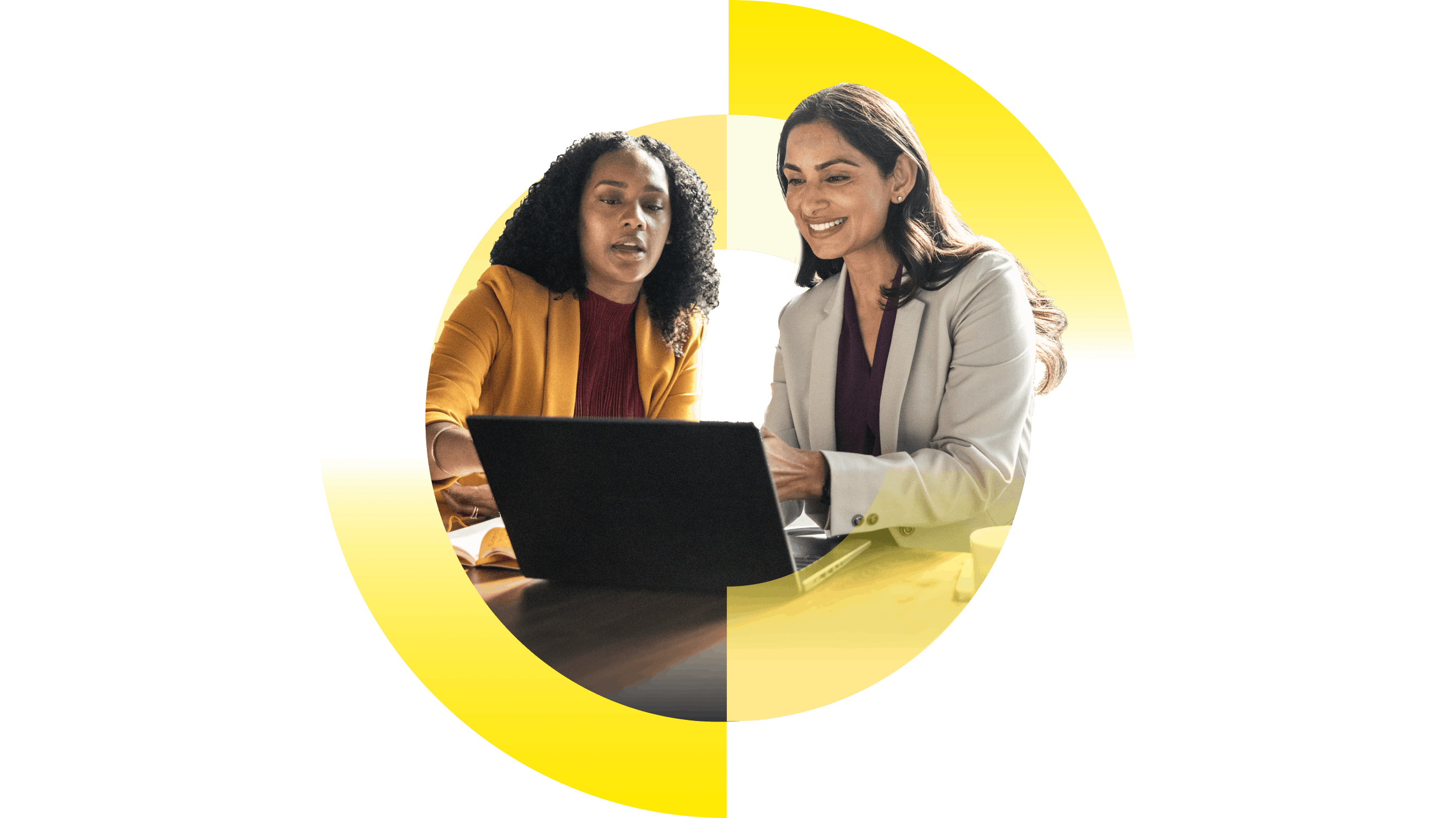 Two business professionals review information on a laptop, illustrating collaboration and decision-making in an AI-driven workplace.