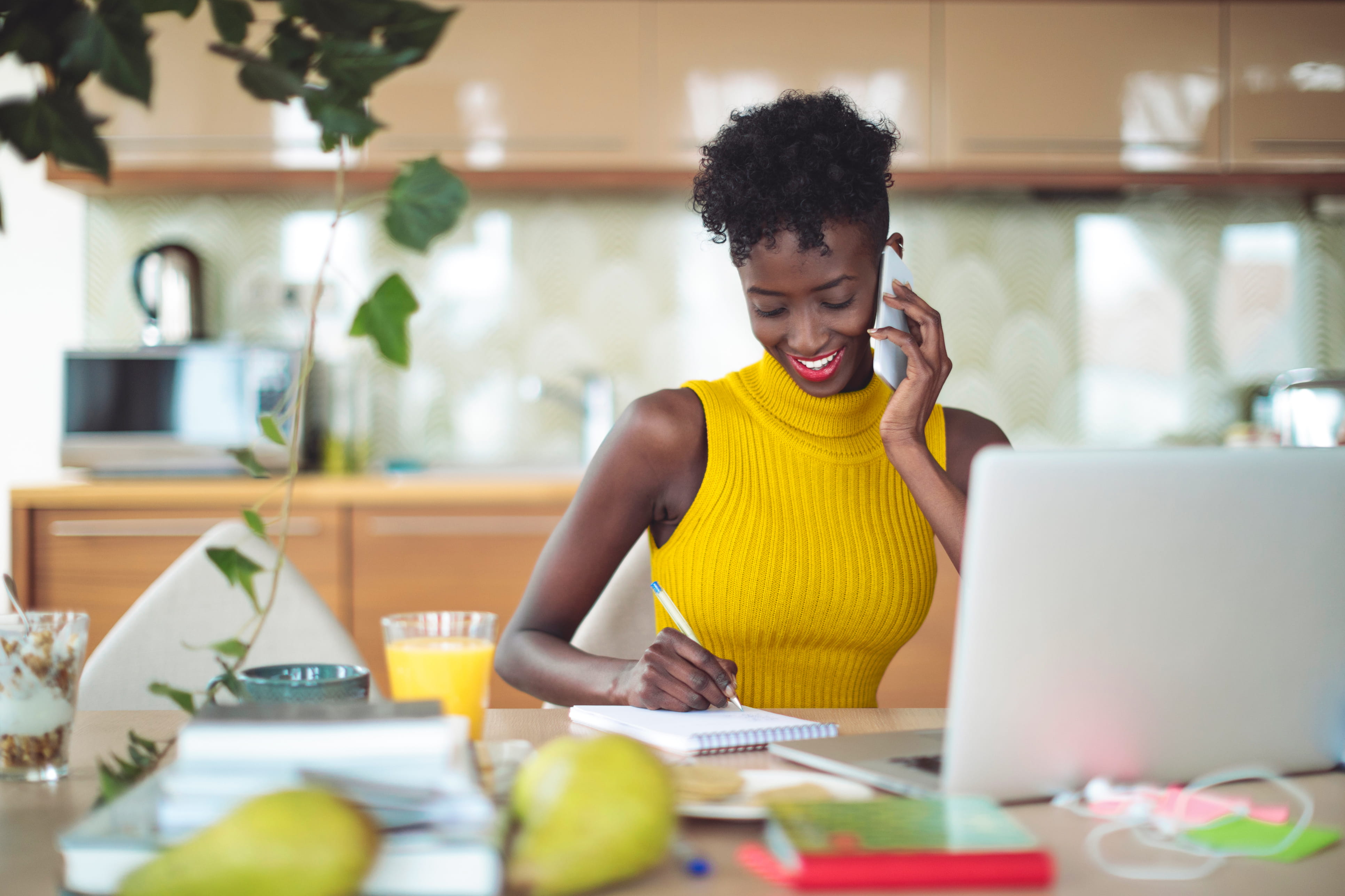 Woman on the phone working at a table