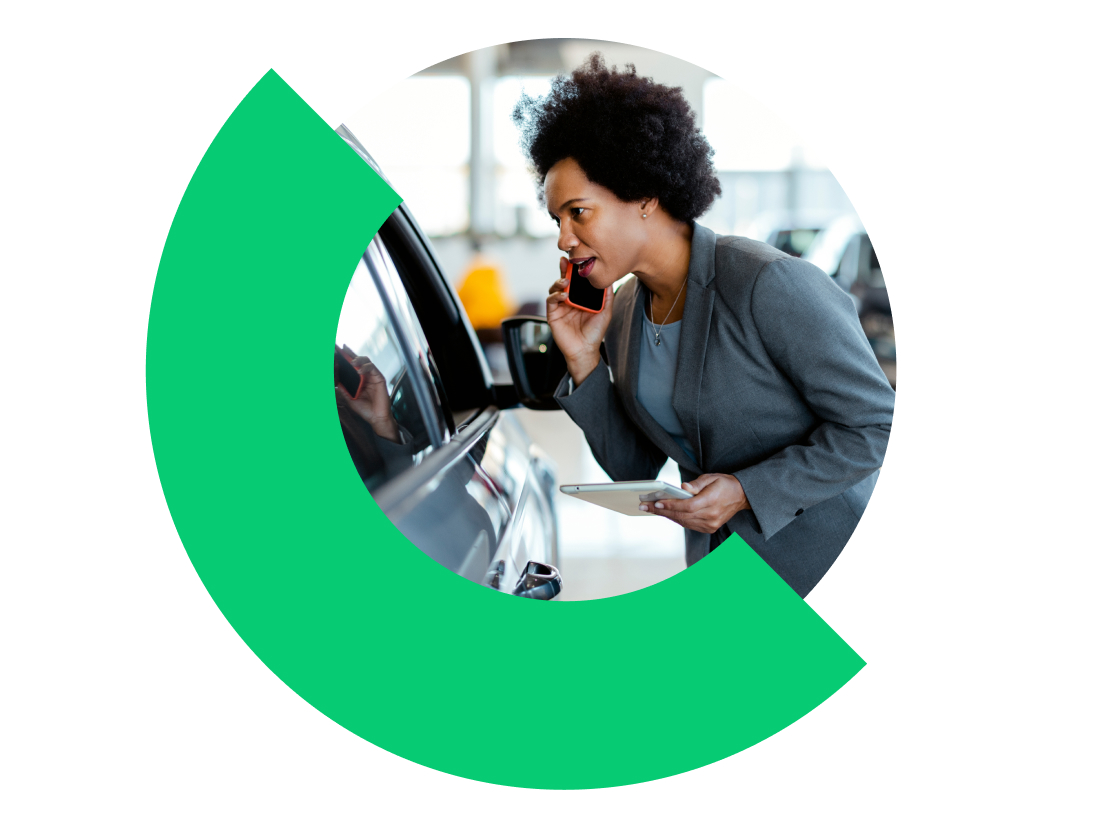 Automotive dealership sales associate using the GoTo app on their cell phone to easily call and follow up with potential customers.