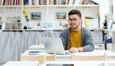 Worker using GoTo Resolve’s remote monitoring and management software on their laptop.