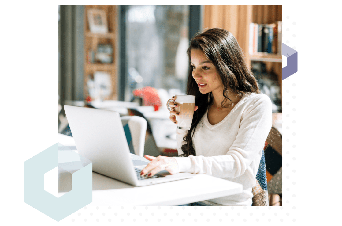 College student sitting in the library accessing an online help desk on her computer.
