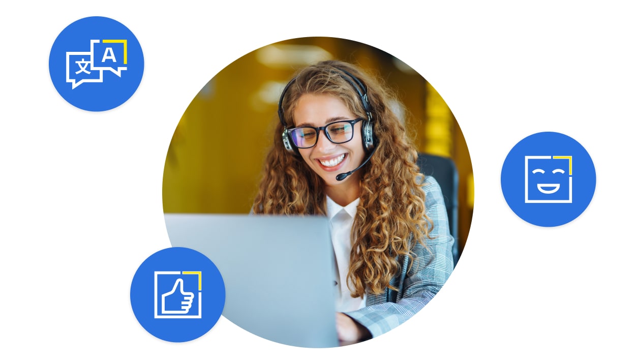 Employee working on computer with headset easily communicating with customers using LogMeIn Rescue’s translation package.