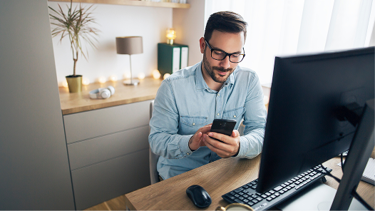 Man checks on his data via multiple devices
