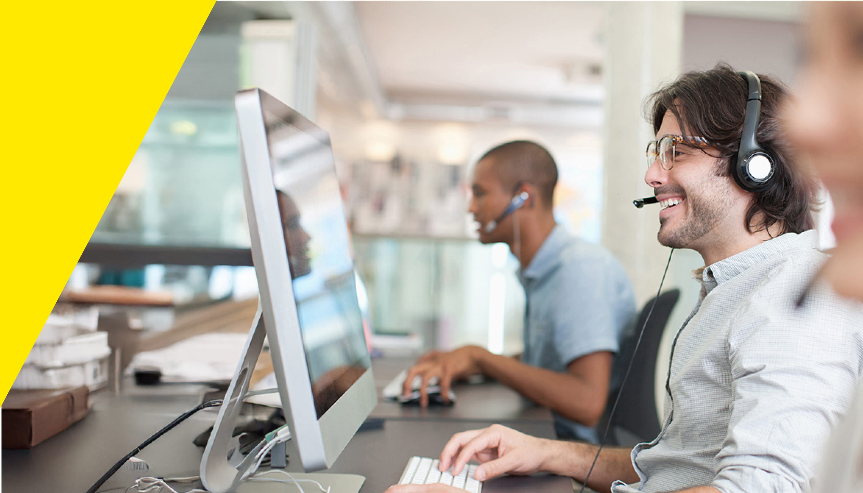 IT center professionals working with clients at the office.