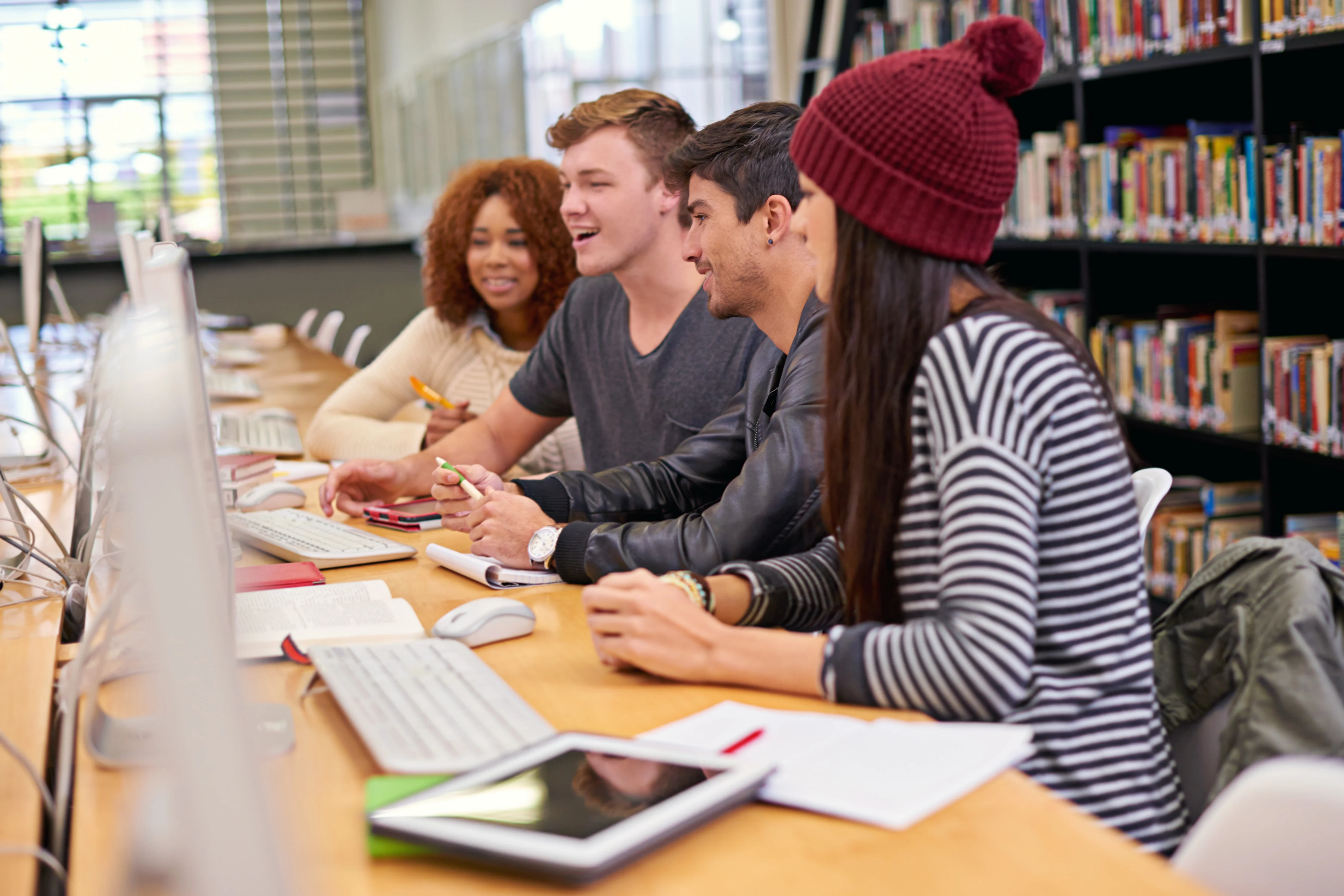 Group of young people interacting in a study room