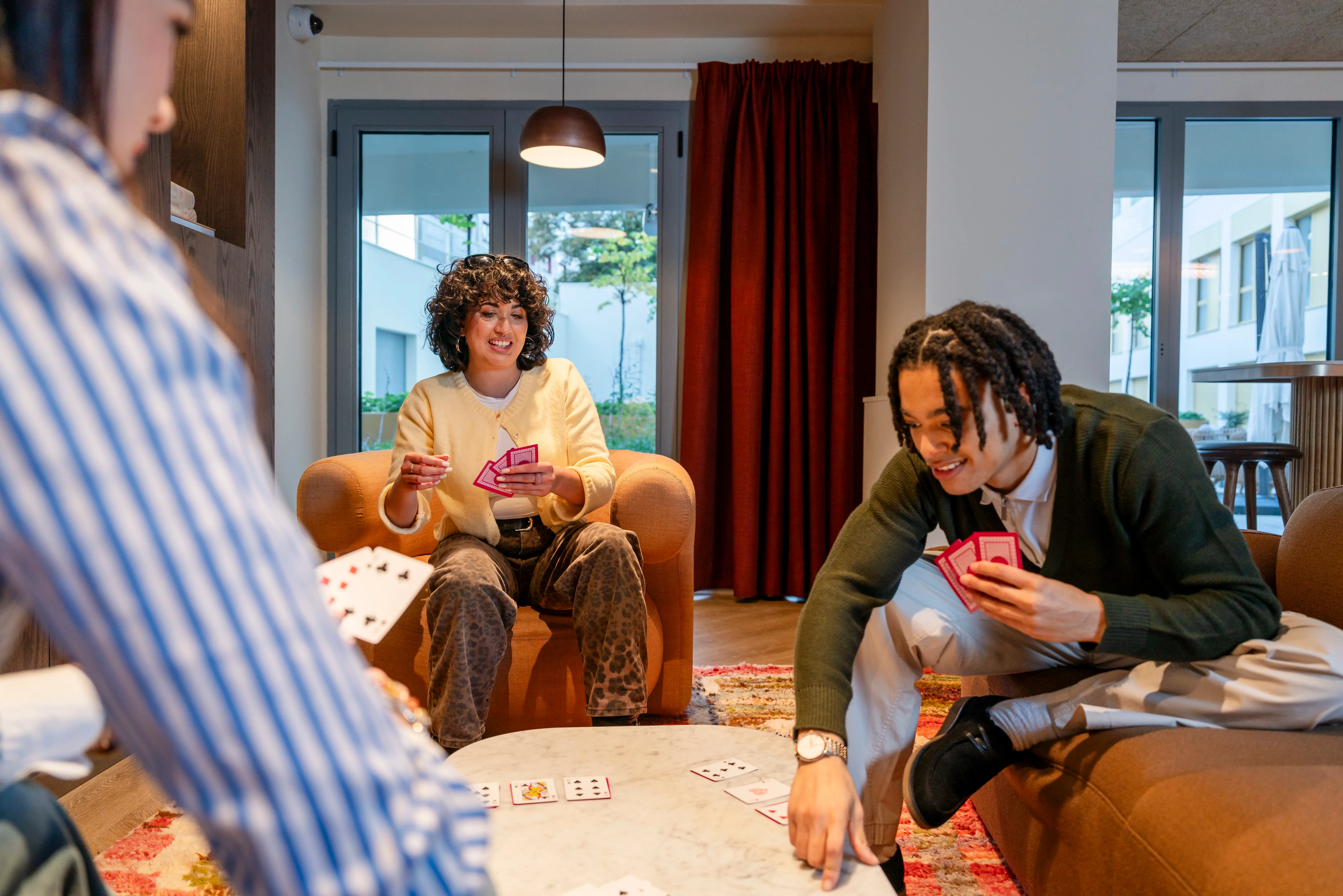 a group of people playing cards
