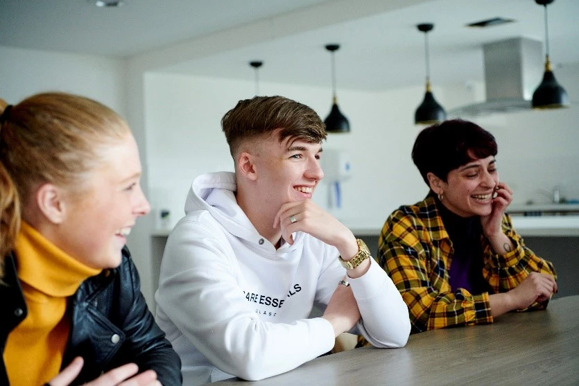 a group of people sitting at a table