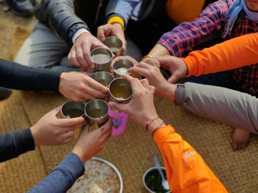 Students of different nationalities celebrating friendship in their student accommodation in Spain.