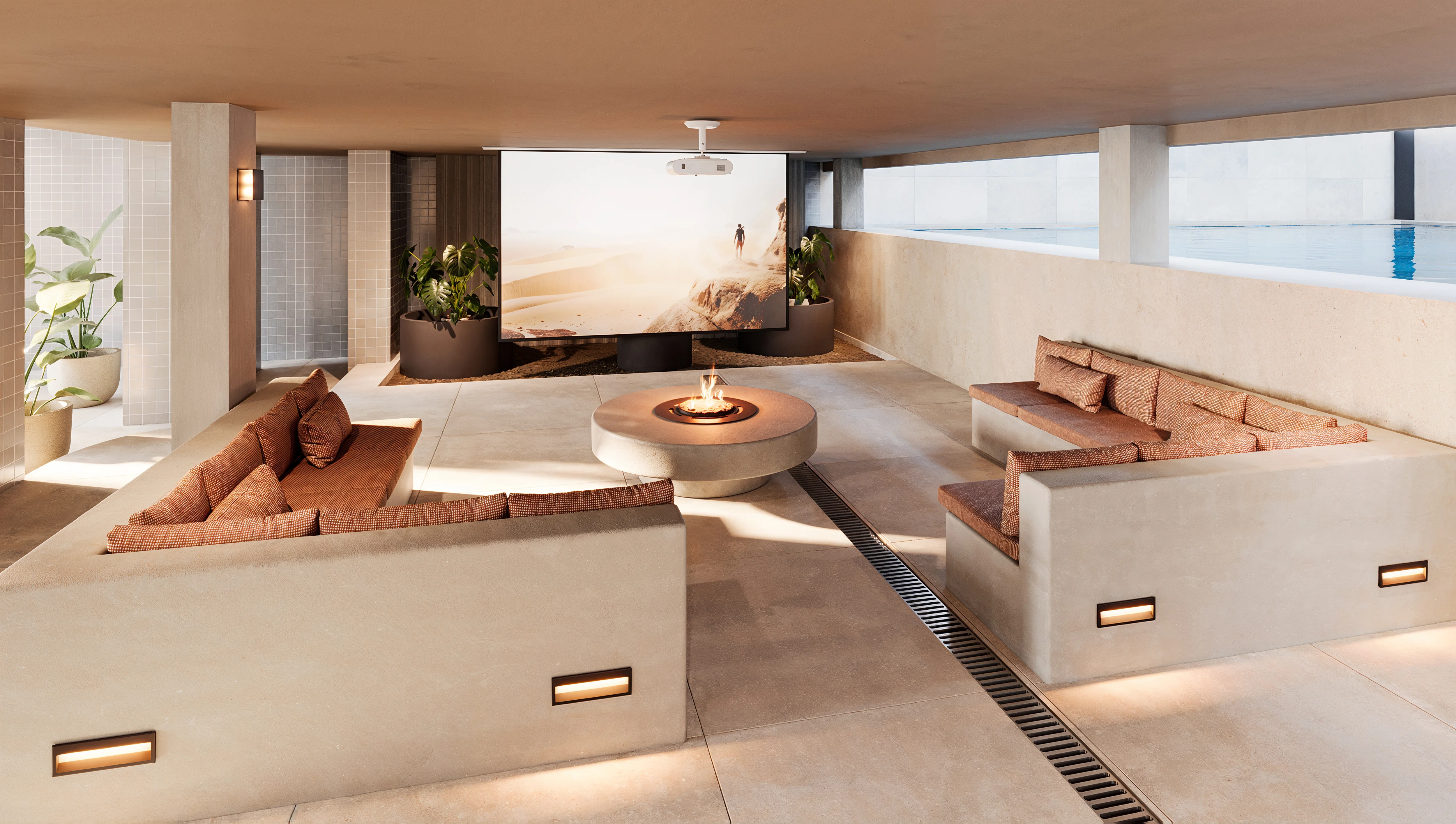 a room with a fire pit and couches