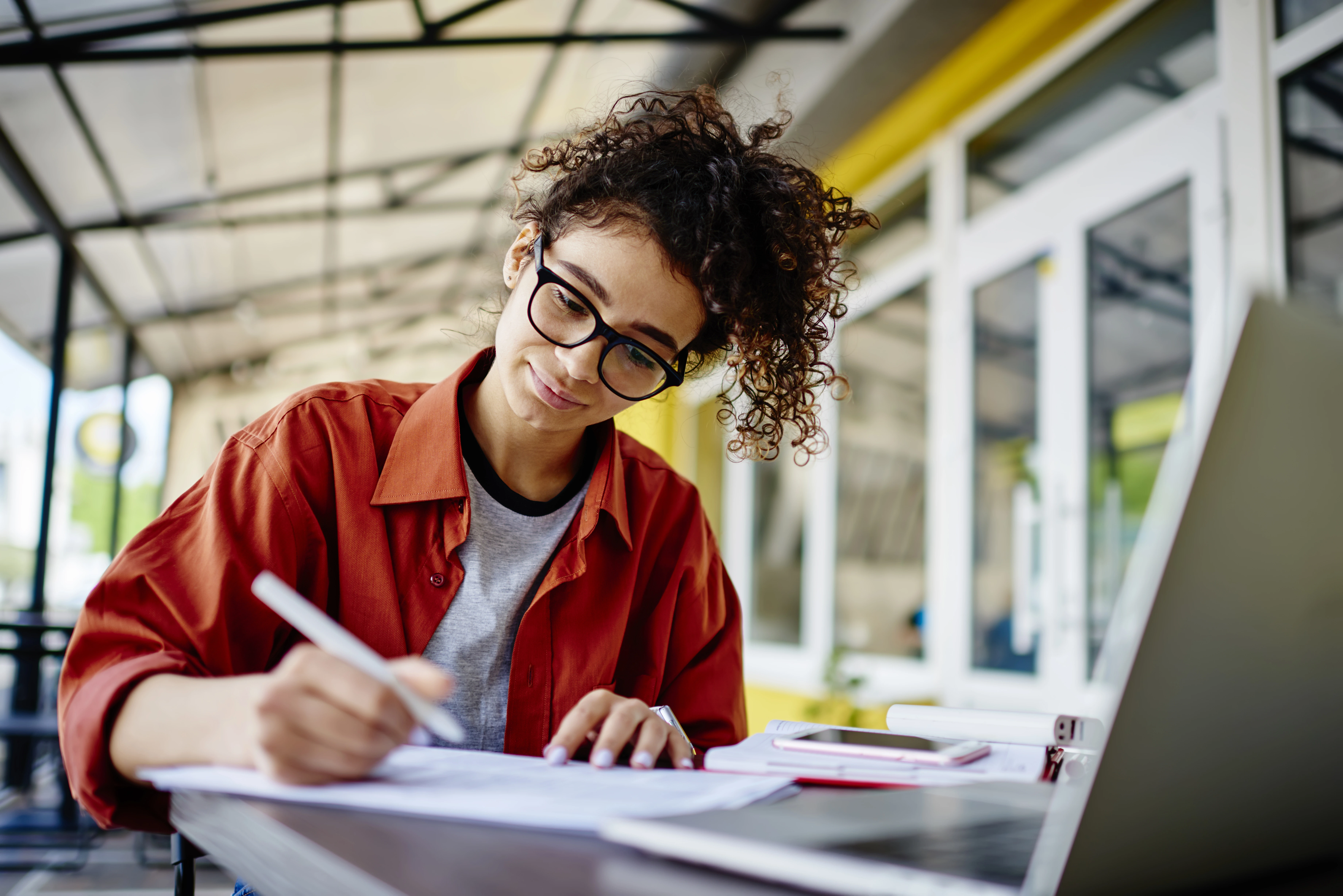 young woman filling in paperwork