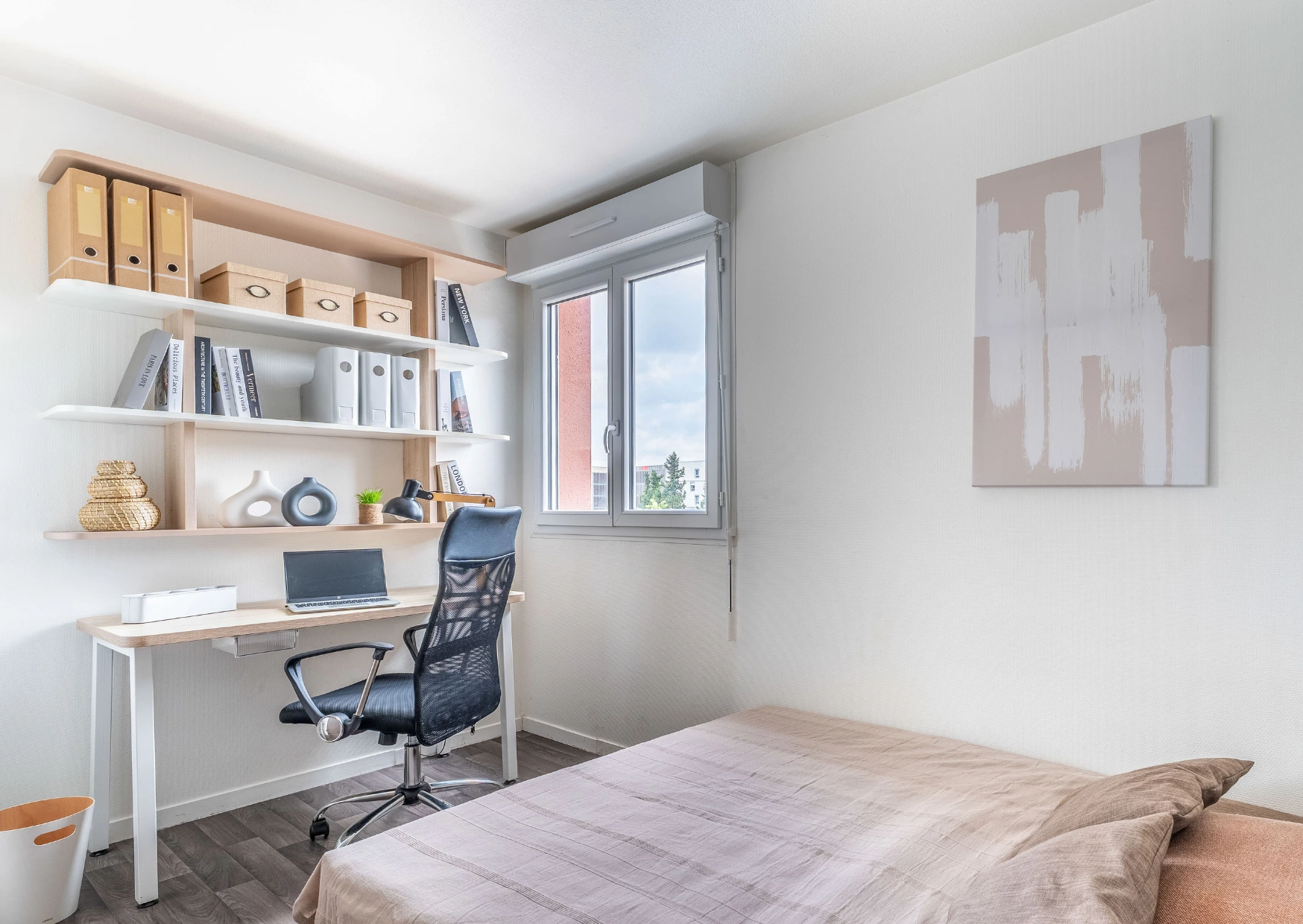 a bedroom with a bed and a desk
