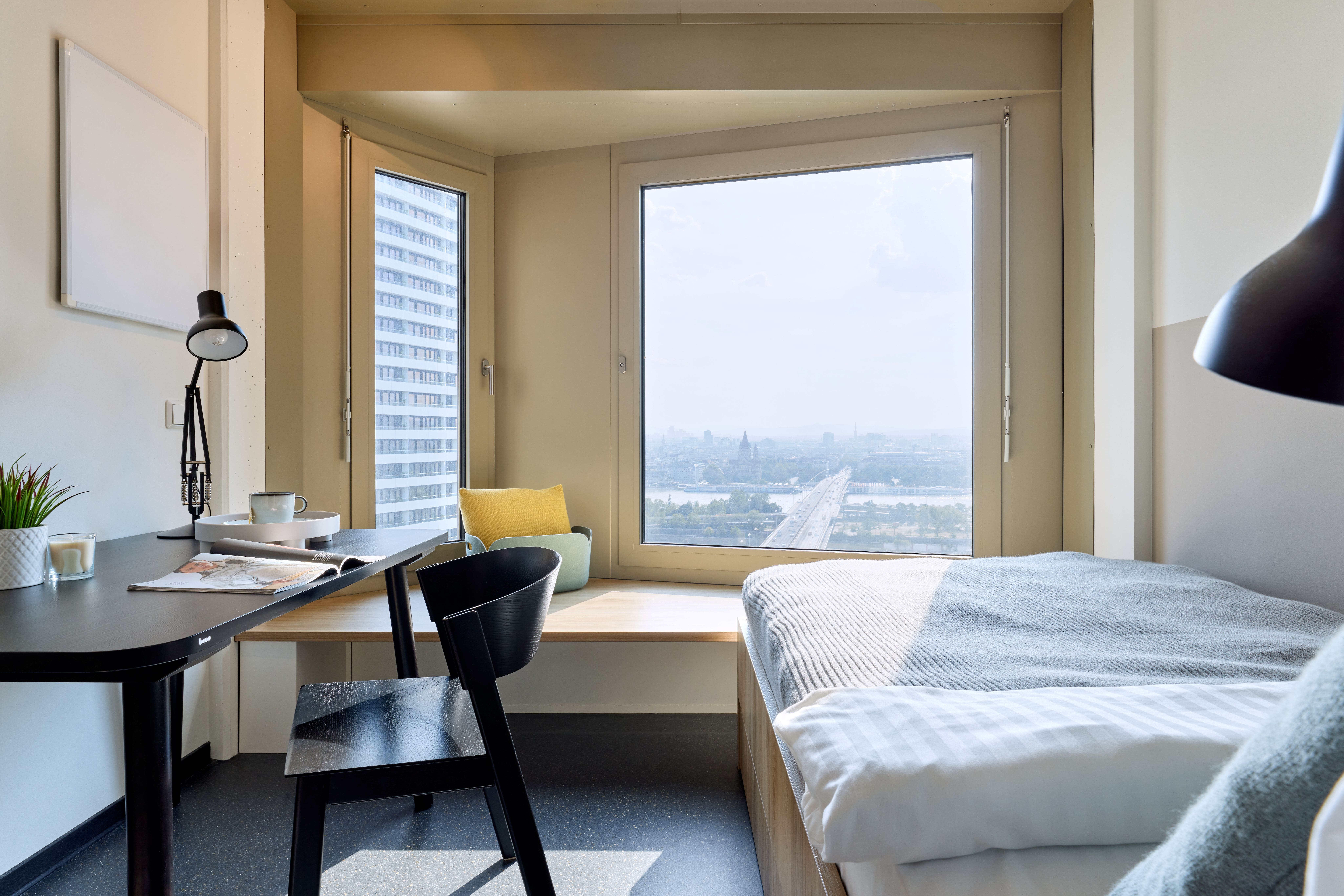 a room with a desk and a bed