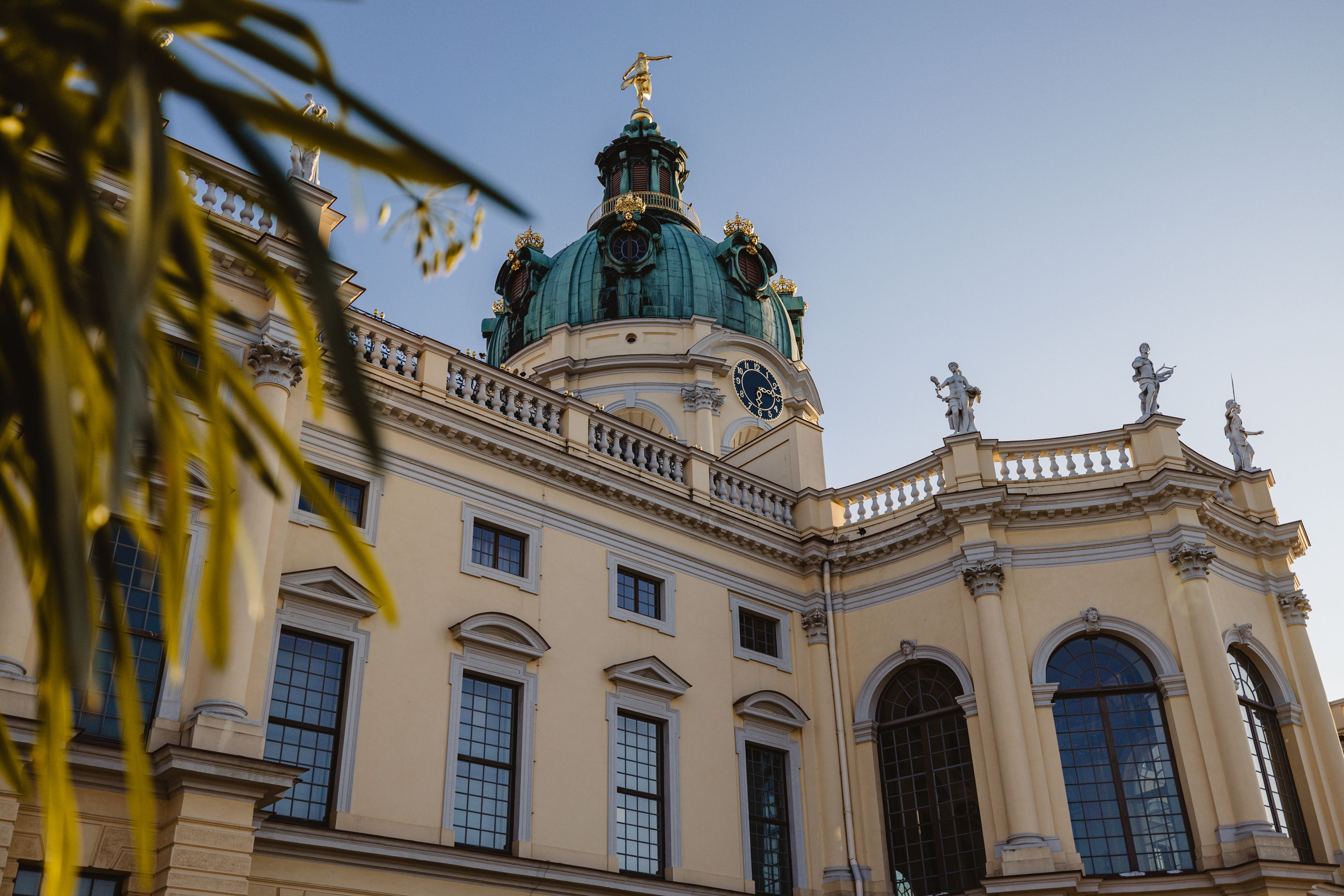 a building with a dome and a clock on top