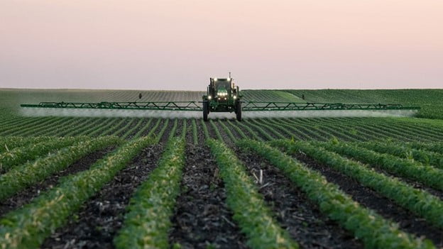 sprayer in soybean field