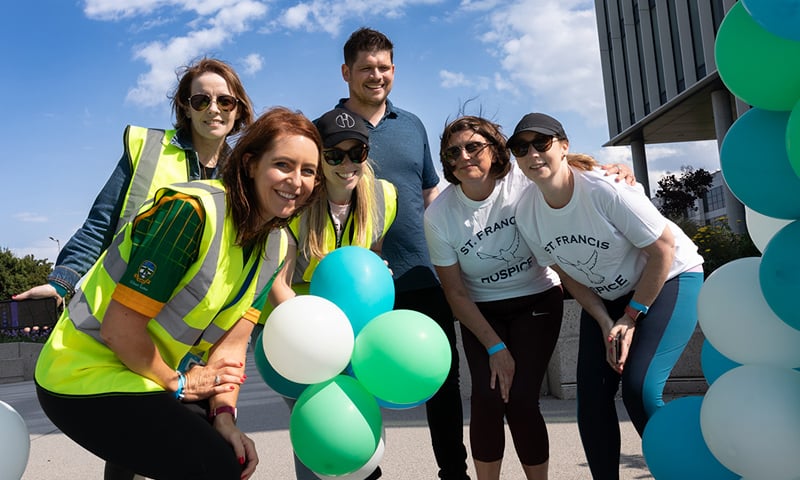 Guidewire volunteers at celebration with balloons