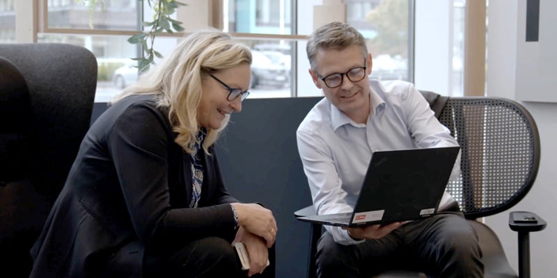 Two people looking at a computer screen